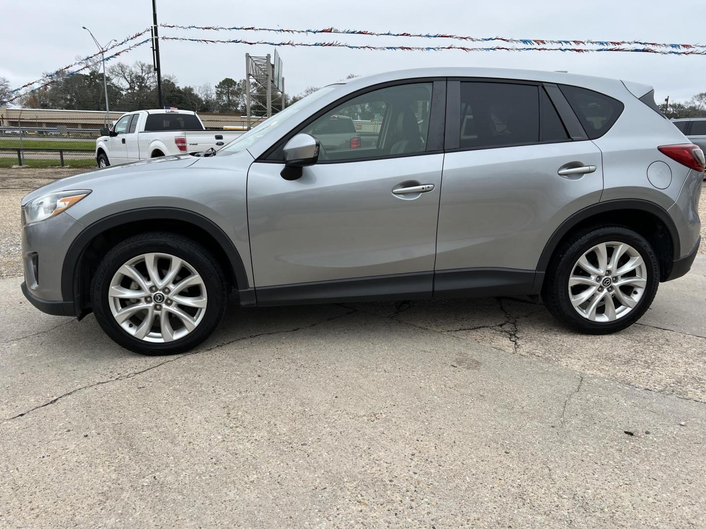 2014 Gray /Black Mazda CX-5 Grand Touring (JM3KE2DY2E0) with an 2.5L L4 DOHC 16V engine, 6-Speed Automatic transmission, located at 4520 Airline Hwy, Baton Rouge, LA, 70805, (225) 357-1497, 30.509325, -91.145432 - 2014 Mazda CX-5 Grand Touring **ONE OWNER** 2.5 4 Cylinder Gas, 162K Miles, Sunroof, Heated Leather Interior, Cold A/C & Heat, Power Windows, Locks, Mirrors & Seat. Front Bumper Has Cracks In Clear Factory Installed Bug Protector. FOR INFO PLEASE CONTACT JEFF AT 225-413-0981 CHECK OUT OUR A+ RATING - Photo#1