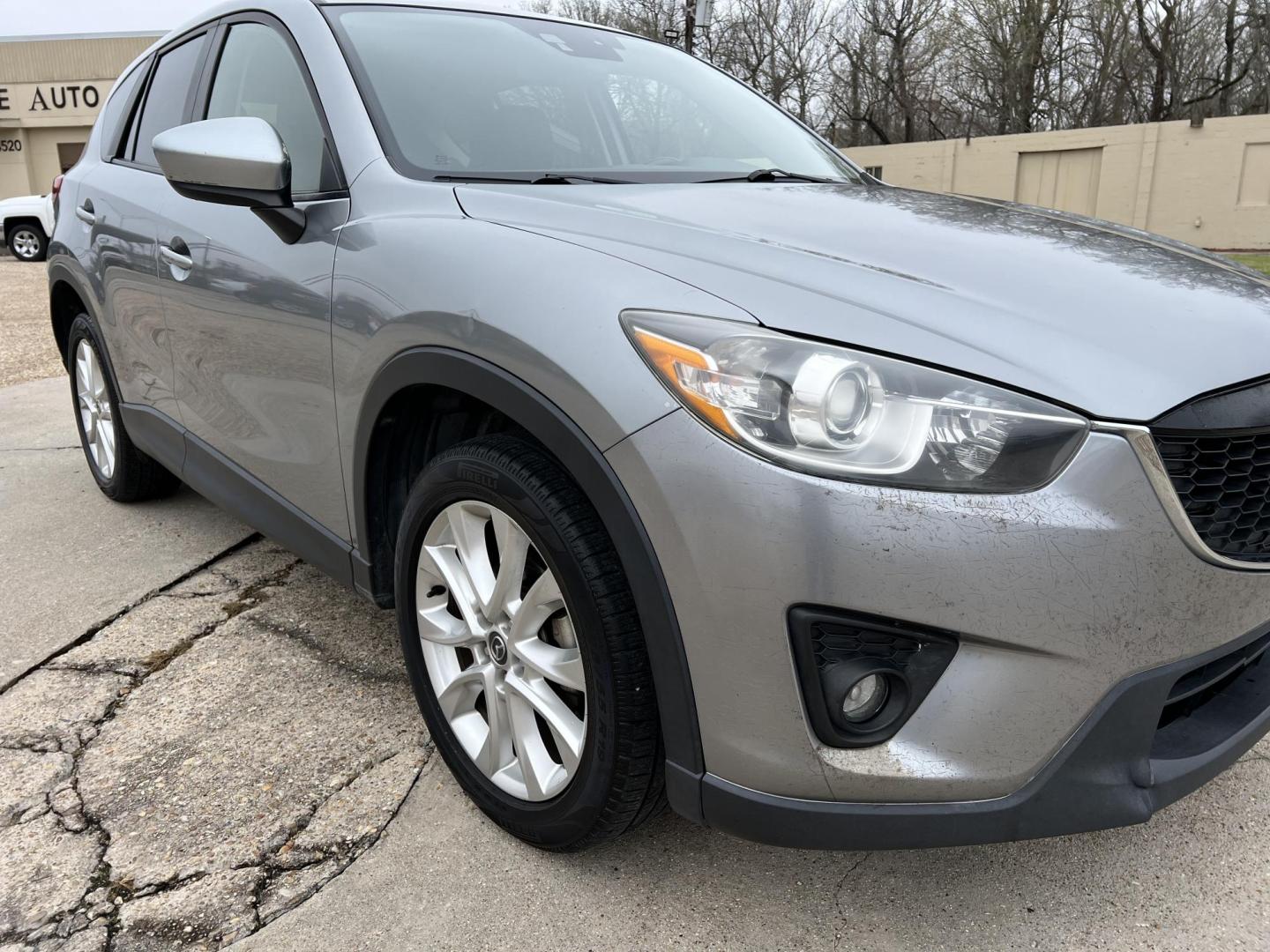 2014 Gray /Black Mazda CX-5 Grand Touring (JM3KE2DY2E0) with an 2.5L L4 DOHC 16V engine, 6-Speed Automatic transmission, located at 4520 Airline Hwy, Baton Rouge, LA, 70805, (225) 357-1497, 30.509325, -91.145432 - 2014 Mazda CX-5 Grand Touring **ONE OWNER** 2.5 4 Cylinder Gas, 162K Miles, Sunroof, Heated Leather Interior, Cold A/C & Heat, Power Windows, Locks, Mirrors & Seat. Front Bumper Has Cracks In Clear Factory Installed Bug Protector. FOR INFO PLEASE CONTACT JEFF AT 225-413-0981 CHECK OUT OUR A+ RATING - Photo#3