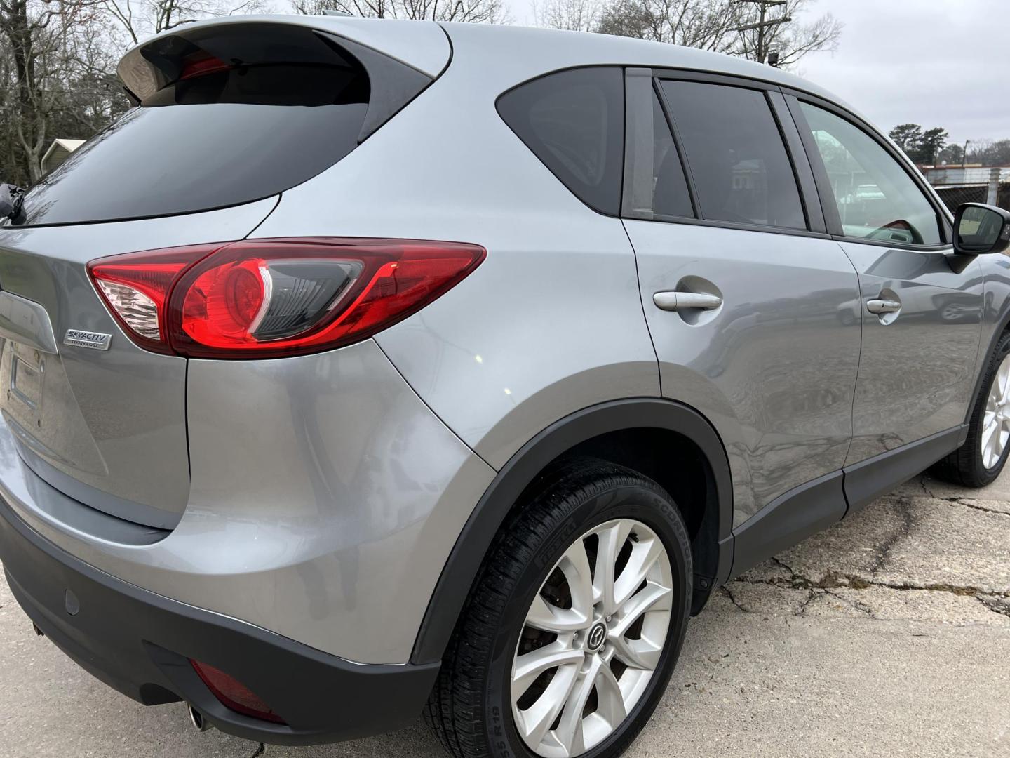 2014 Gray /Black Mazda CX-5 Grand Touring (JM3KE2DY2E0) with an 2.5L L4 DOHC 16V engine, 6-Speed Automatic transmission, located at 4520 Airline Hwy, Baton Rouge, LA, 70805, (225) 357-1497, 30.509325, -91.145432 - 2014 Mazda CX-5 Grand Touring **ONE OWNER** 2.5 4 Cylinder Gas, 162K Miles, Sunroof, Heated Leather Interior, Cold A/C & Heat, Power Windows, Locks, Mirrors & Seat. Front Bumper Has Cracks In Clear Factory Installed Bug Protector. FOR INFO PLEASE CONTACT JEFF AT 225-413-0981 CHECK OUT OUR A+ RATING - Photo#5