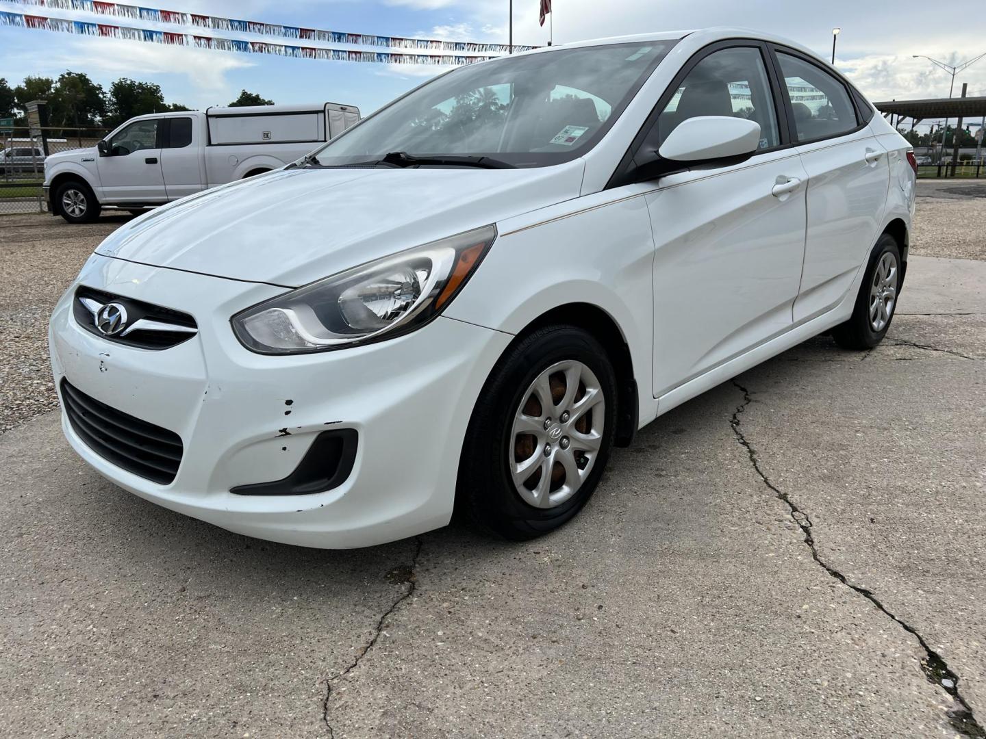 2014 White /Tan Hyundai Accent GLS (KMHCT4AE6EU) with an 1.6L L4 DOHC 16V engine, Automatic transmission, located at 4520 Airline Hwy, Baton Rouge, LA, 70805, (225) 357-1497, 30.509325, -91.145432 - 2014 Hyundai Accent GLS 1.6L Gas **ONLY 32K Miles** Cold A/C, Power Windows, Locks & Mirrors, Has A Couple Of Scuff Mark On Bumper. FOR INFO PLEASE CONTACT JEFF AT 225-413-0981 CHECK OUT OUR A+ RATING WITH THE BETTER BUSINESS BUREAU WE HAVE BEEN A FAMILY OWNED AND OPERATED BUSINESS AT THE SAME LOCA - Photo#0
