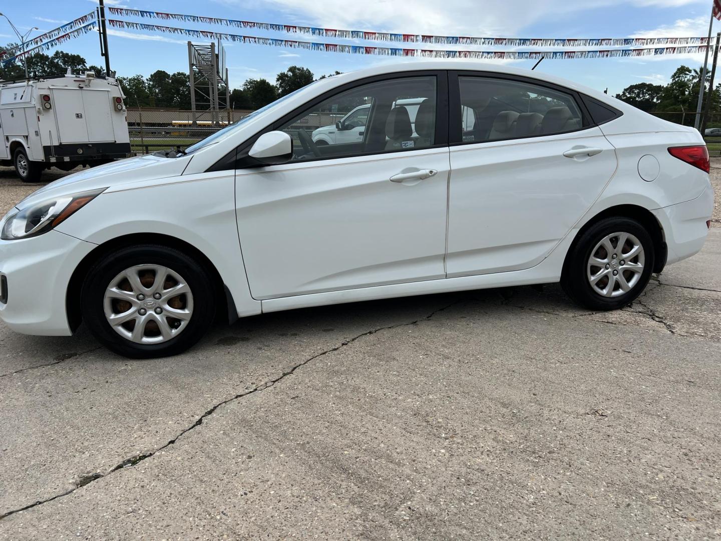2014 White /Tan Hyundai Accent GLS (KMHCT4AE6EU) with an 1.6L L4 DOHC 16V engine, Automatic transmission, located at 4520 Airline Hwy, Baton Rouge, LA, 70805, (225) 357-1497, 30.509325, -91.145432 - 2014 Hyundai Accent GLS 1.6L Gas **ONLY 32K Miles** Cold A/C, Power Windows, Locks & Mirrors, Has A Couple Of Scuff Mark On Bumper. FOR INFO PLEASE CONTACT JEFF AT 225-413-0981 CHECK OUT OUR A+ RATING WITH THE BETTER BUSINESS BUREAU WE HAVE BEEN A FAMILY OWNED AND OPERATED BUSINESS AT THE SAME LOCA - Photo#1