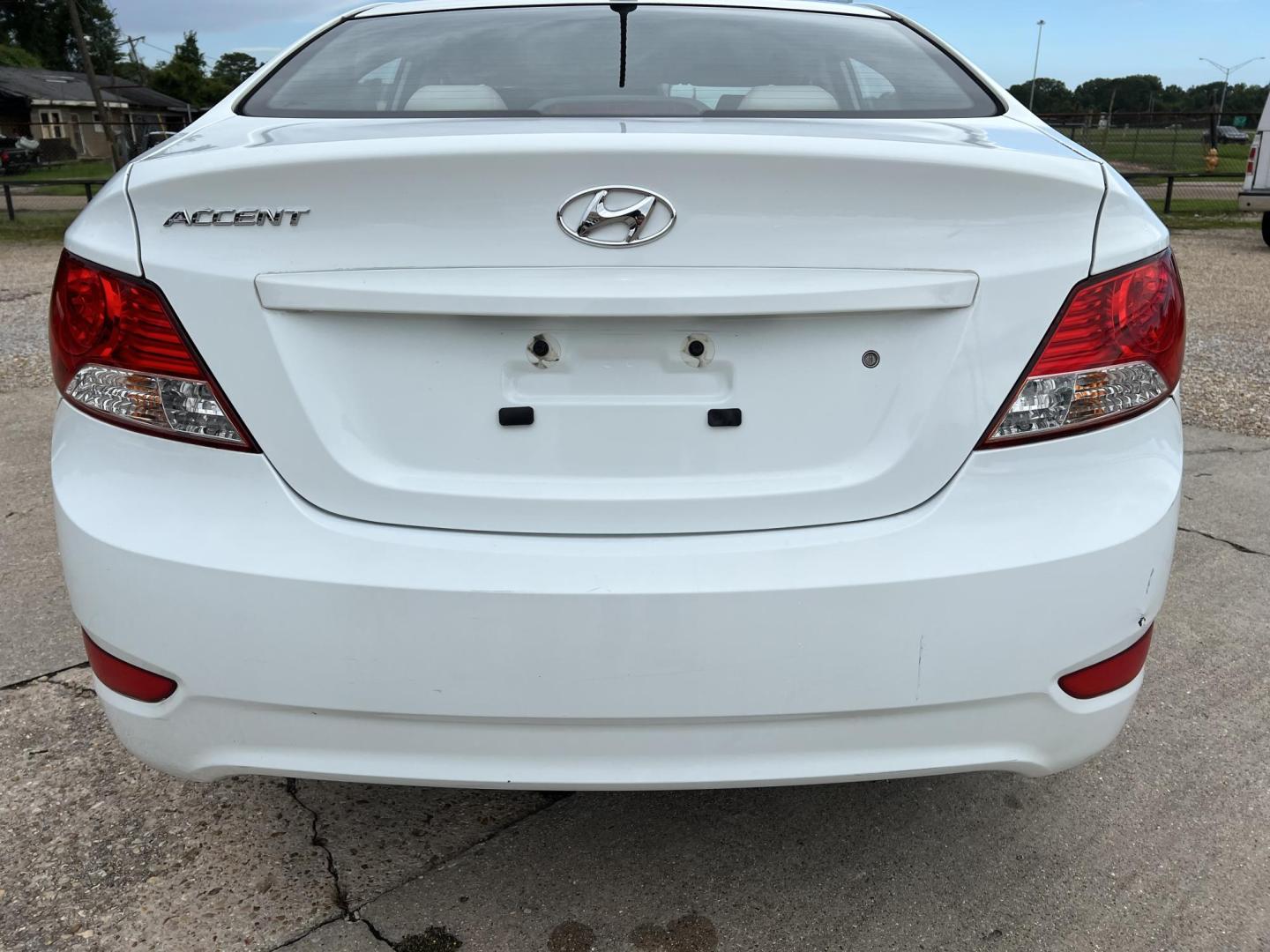 2014 White /Tan Hyundai Accent GLS (KMHCT4AE6EU) with an 1.6L L4 DOHC 16V engine, Automatic transmission, located at 4520 Airline Hwy, Baton Rouge, LA, 70805, (225) 357-1497, 30.509325, -91.145432 - 2014 Hyundai Accent GLS 1.6L Gas **ONLY 32K Miles** Cold A/C, Power Windows, Locks & Mirrors, Has A Couple Of Scuff Mark On Bumper. FOR INFO PLEASE CONTACT JEFF AT 225-413-0981 CHECK OUT OUR A+ RATING WITH THE BETTER BUSINESS BUREAU WE HAVE BEEN A FAMILY OWNED AND OPERATED BUSINESS AT THE SAME LOCA - Photo#6