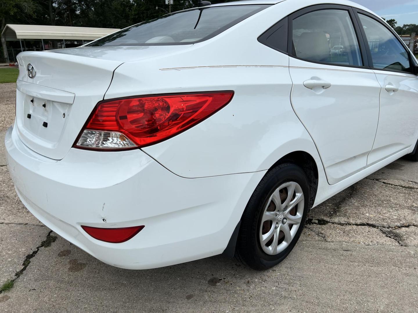 2014 White /Tan Hyundai Accent GLS (KMHCT4AE6EU) with an 1.6L L4 DOHC 16V engine, Automatic transmission, located at 4520 Airline Hwy, Baton Rouge, LA, 70805, (225) 357-1497, 30.509325, -91.145432 - 2014 Hyundai Accent GLS 1.6L Gas **ONLY 32K Miles** Cold A/C, Power Windows, Locks & Mirrors, Has A Couple Of Scuff Mark On Bumper. FOR INFO PLEASE CONTACT JEFF AT 225-413-0981 CHECK OUT OUR A+ RATING WITH THE BETTER BUSINESS BUREAU WE HAVE BEEN A FAMILY OWNED AND OPERATED BUSINESS AT THE SAME LOCA - Photo#5