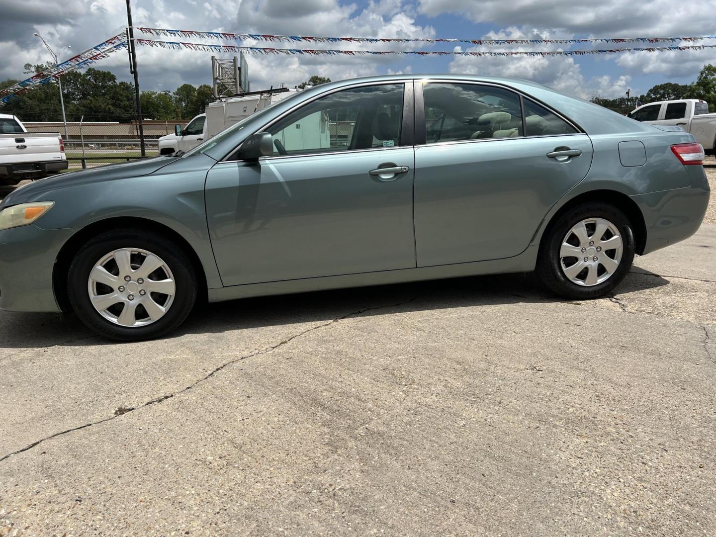 2011 Green /Tan Toyota Camry LE (4T1BF3EK8BU) with an 2.5L L4 DOHC 16V engine, Automatic transmission, located at 4520 Airline Hwy, Baton Rouge, LA, 70805, (225) 357-1497, 30.509325, -91.145432 - 2011 Toyota Camry LE 2.5L Gas, 203K Miles, Cold A/C, Power Windows, Locks & Mirrors. FOR INFO PLEASE CONTACT JEFF AT 225-413-0981 CHECK OUT OUR A+ RATING WITH THE BETTER BUSINESS BUREAU WE HAVE BEEN A FAMILY OWNED AND OPERATED BUSINESS AT THE SAME LOCATION FOR OVER 45 YEARS. WE STRIVE TO KEEP CUSTO - Photo#1