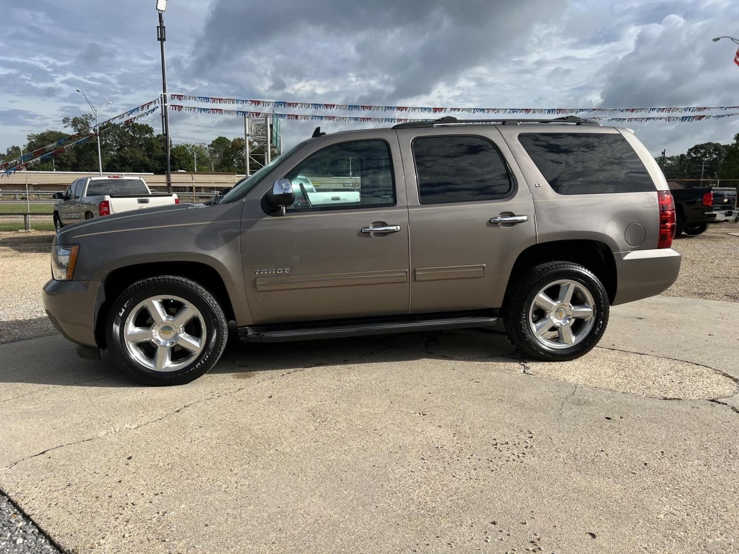 2013 Brown /Tan Chevrolet Tahoe LT (1GNSCBE0XDR) with an 5.3L V8 OHV 16V FFV engine, 6-Speed Automatic transmission, located at 4520 Airline Hwy, Baton Rouge, LA, 70805, (225) 357-1497, 30.509325, -91.145432 - 2013 Chevrolet Tahoe LT 2WD 5.3 V8 Gas, 141K Miles, Heated Leather, Seating For 7, Cold A/C, All Power, Backup Camera, 20 Inch Factory Alloy Wheels, Tow Package. FOR INFO PLEASE CONTACT JEFF AT 225-413-0981 CHECK OUT OUR A+ RATING WITH THE BETTER BUSINESS BUREAU WE HAVE BEEN A FAMILY-OWNED AND OP - Photo#1