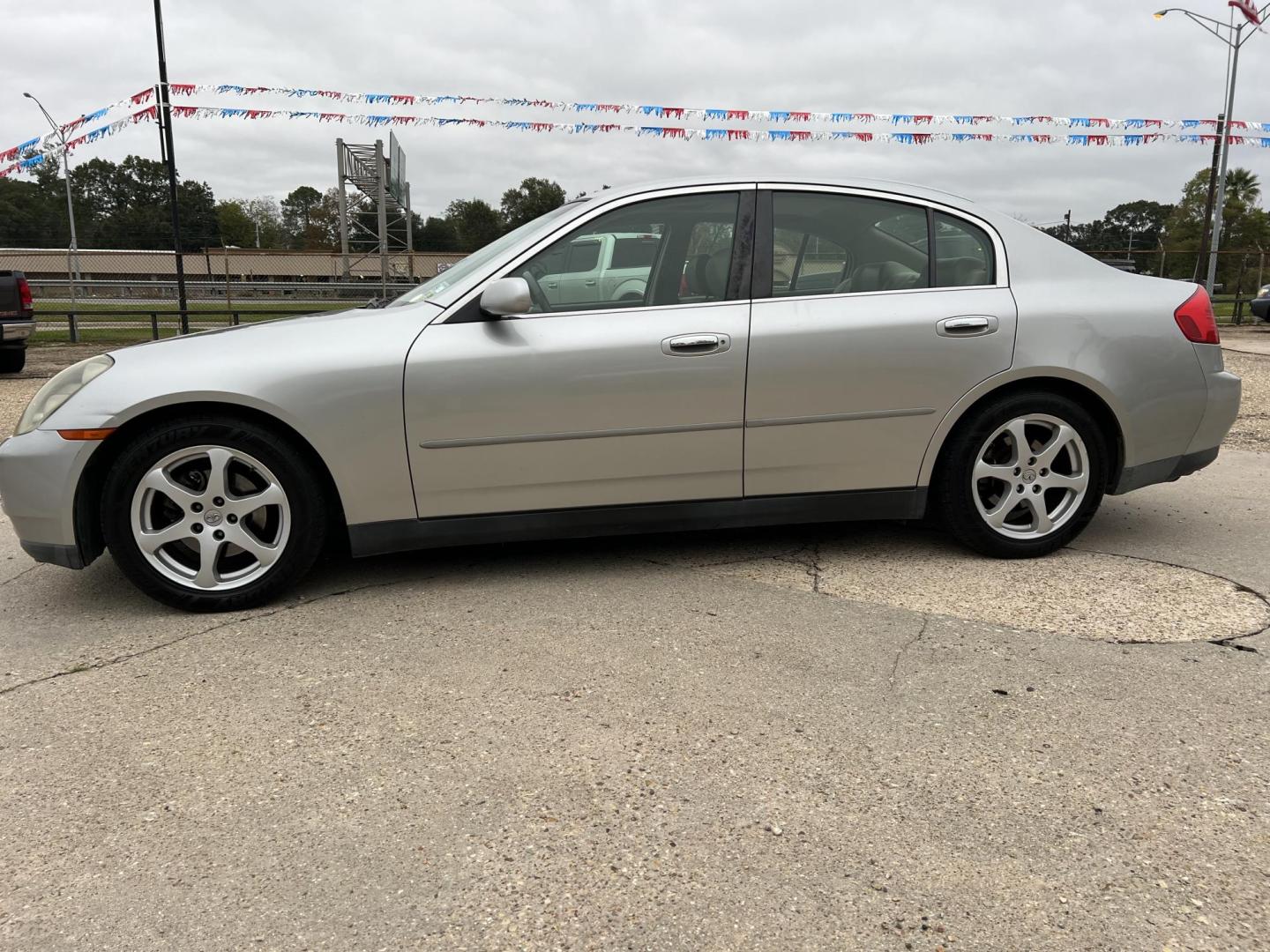 2004 Silver /Gray Infiniti G35 (JNKCV51E14M) with an 3.5L V6 DOHC 24V engine, 5-Speed Automatic Overdrive transmission, located at 4520 Airline Hwy, Baton Rouge, LA, 70805, (225) 357-1497, 30.509325, -91.145432 - 2004 Infiniti G35 ***TWO OWNER & NO ACCIDENTS*** 3.5 V6 Gas, Only 72K Miles, Heated Leather, Sunroof, A/C & Heat, Power Seat, Windows, Locks & Mirrors. FOR INFO PLEASE CONTACT JEFF AT 225-413-0981. CHECK OUT OUR A+ RATING WITH THE BETTER BUSINESS BUREAU. WE HAVE BEEN A FAMILY OWNED AND OPERATED BUS - Photo#1