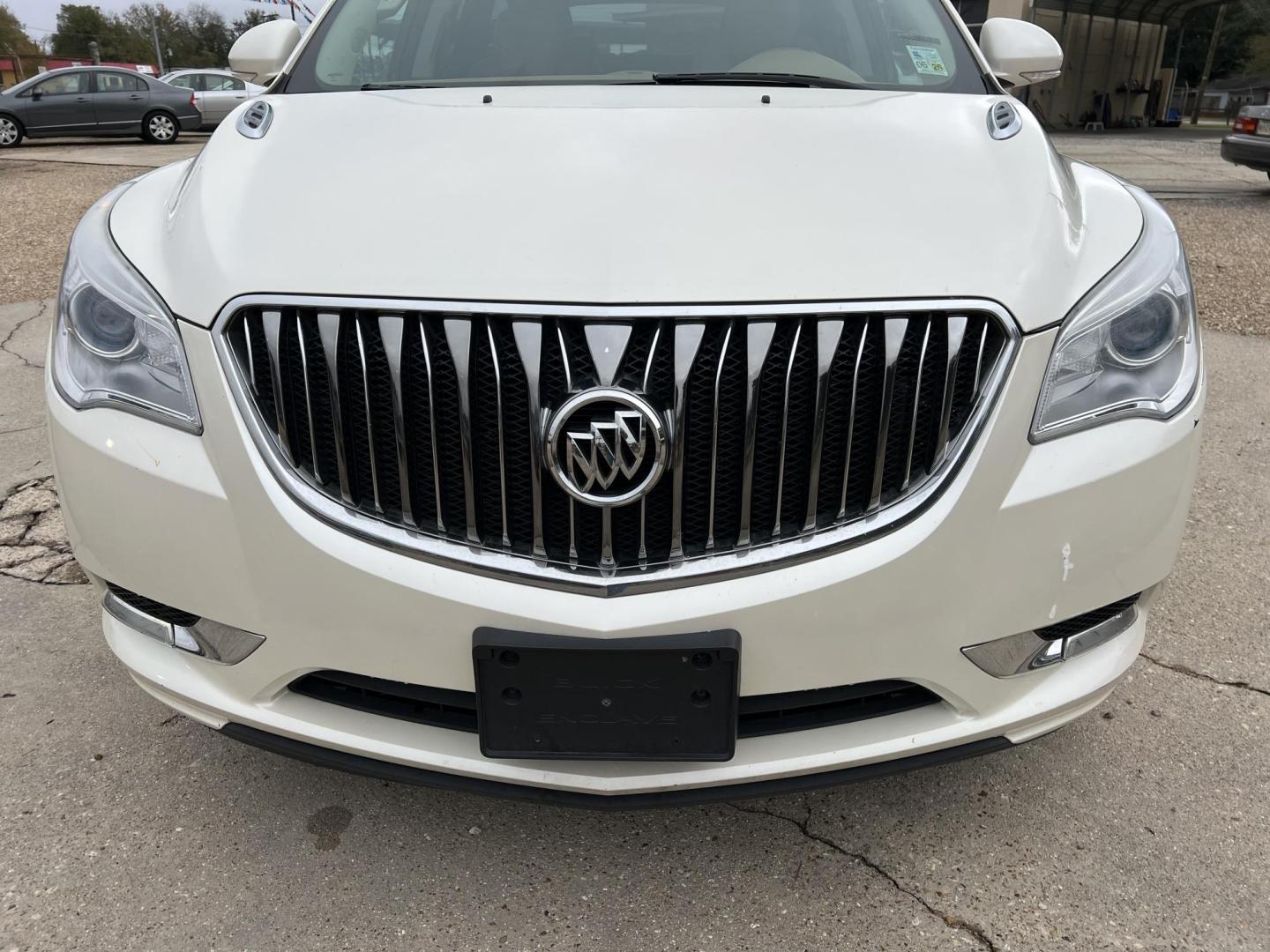 2015 White /Peanut Butter Buick Enclave Premium (5GAKRCKD4FJ) with an 3.6L V6 DOHC 24V engine, 6-Speed Automatic Overdrive transmission, located at 4520 Airline Hwy, Baton Rouge, LA, 70805, (225) 357-1497, 30.509325, -91.145432 - 2015 Buick Enclave Premium **NO ACCIDENTS** 3.6 V6 Gas, 121K Miles, Sunroof, Heated & Cooled Leather Seats, 7 Passenger Seating, All Power, Bose Stereo, Backup Camera, Tow Package & More. FOR INFO PLEASE CONTACT JEFF AT 225-413-0981. CHECK OUT OUR A+ RATING WITH THE BETTER BUSINESS BUREAU. WE HAVE B - Photo#2