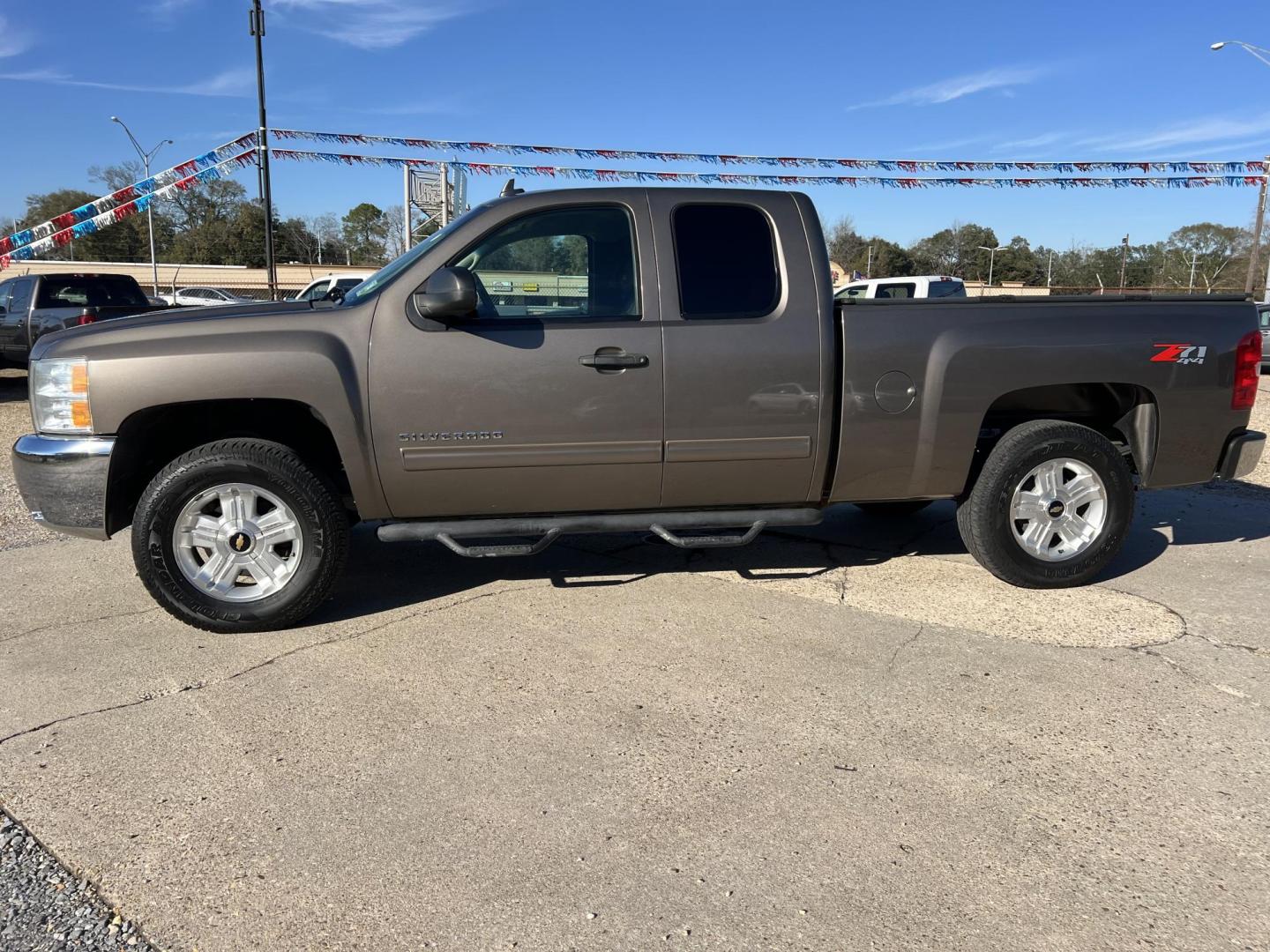2012 Brown /Black Chevrolet Silverado 1500 LT Z71 (1GCRKSE76CZ) with an 5.3L V8 engine, 6-Speed Automatic transmission, located at 4520 Airline Hwy, Baton Rouge, LA, 70805, (225) 357-1497, 30.509325, -91.145432 - 2012 Chevrolet Silverado 1500 Ext Cab LT Z71 4X4 5.3 V8 Gas, 176K Miles, Leather Seats, Cold A/C, Power Windows, Locks & Mirrors, Bed Cover, Tow Package. FOR INFO PLEASE CONTACT JEFF AT 225-413-0981. CHECK OUT OUR A+ RATING WITH THE BETTER BUSINESS BUREAU. WE HAVE BEEN A FAMILY OWNED AND OPERATED - Photo#1