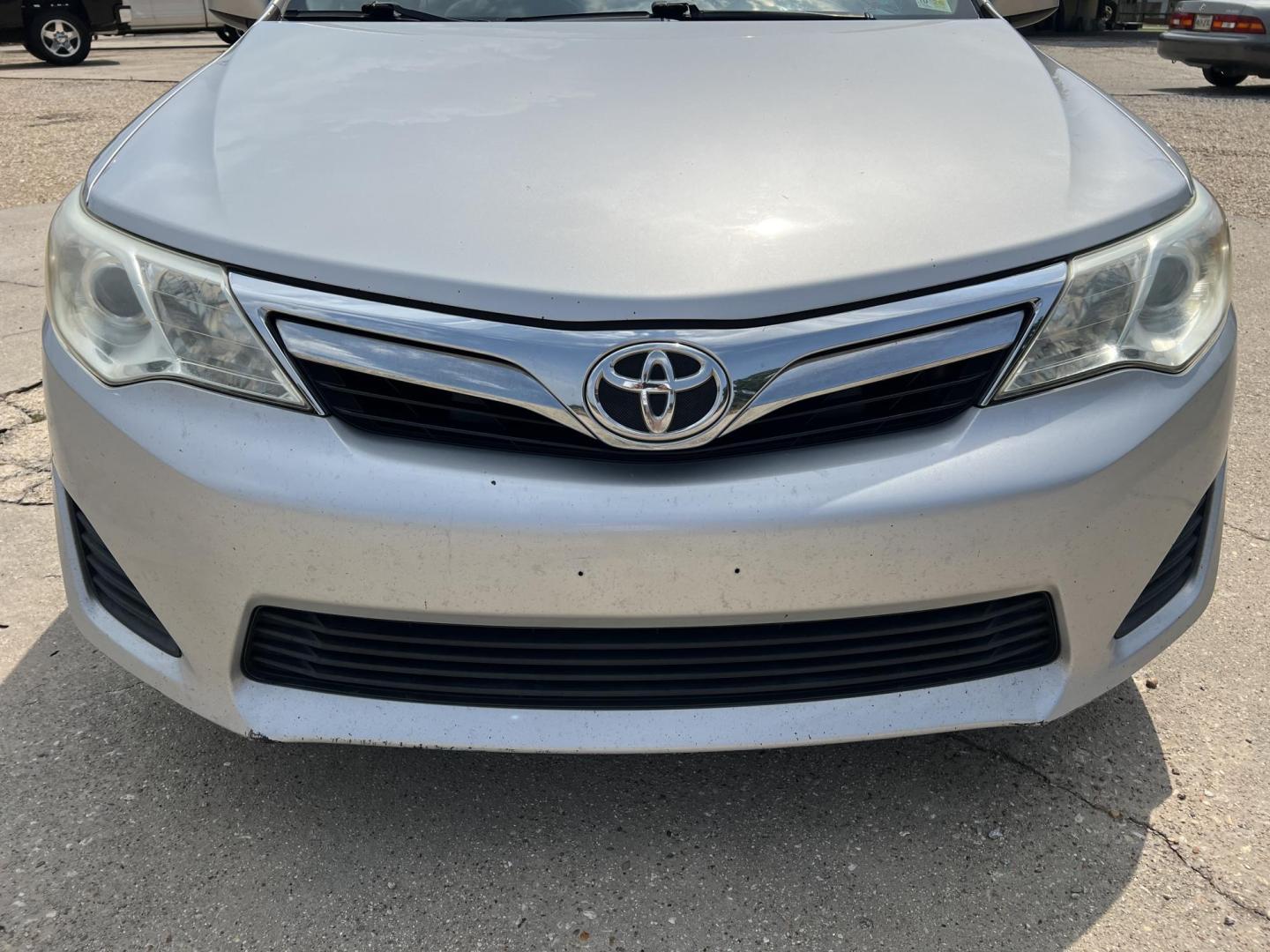 2014 Silver /Gray Toyota Camry LE (4T1BF1FK9EU) with an 2.5L L4 DOHC 16V engine, 6-Speed Automatic transmission, located at 4520 Airline Hwy, Baton Rouge, LA, 70805, (225) 357-1497, 30.509325, -91.145432 - 2014 Toyota Camry LE 2.5L 4 Cylinder Gas Saver, 182K Miles, Automatic, Bluetooth Radio, Cold A/C, Power Windows, Locks & Mirrors, Seating For 5. Always Serviced At Toyota Dealer. FOR INFO PLEASE CONTACT JEFF AT 225-413-0981. CHECK OUT OUR A+ RATING WITH THE BETTER BUSINESS BUREAU. WE HAVE BEEN A FA - Photo#2