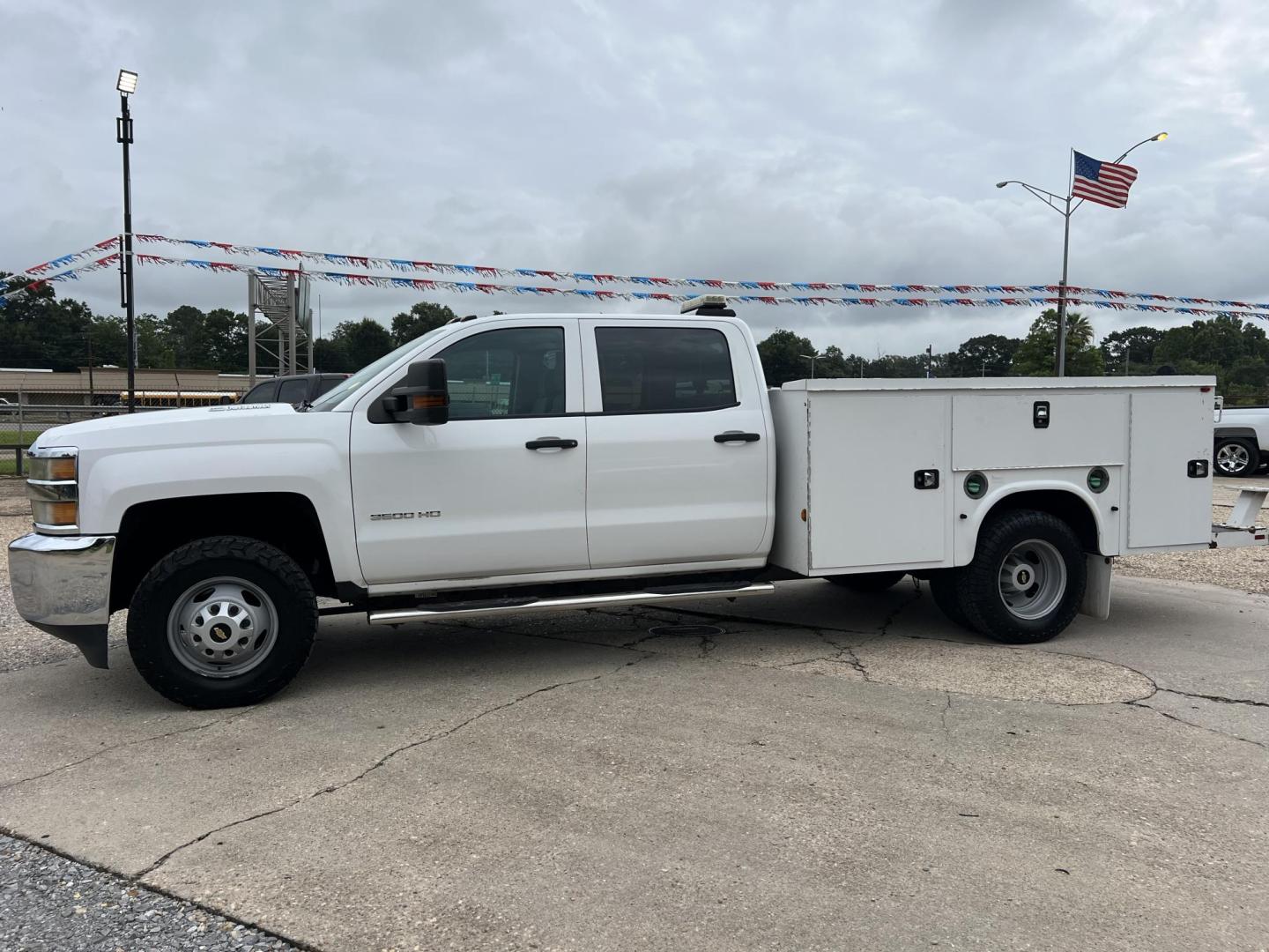 2015 White /Gray Chevrolet Silverado 3500HD Work Truck (1GB4KYC80FF) with an 6.6L V8 OHV 32V TURBO DIESEL engine, Allison transmission, located at 4520 Airline Hwy, Baton Rouge, LA, 70805, (225) 357-1497, 30.509325, -91.145432 - 2015 Chevrolet Silverado 3500HD Crew Cab 4X4 **ONE OWNER & NO ACCIDENTS** 6.6 Duramax Diesel, Allison Transmission, 196K Miles, Cold A/C, Power Windows, Locks & Mirrors, Knapheide Utility Bed, Back Seat Is Missing. FOR INFO PLEASE CONTACT JEFF AT 225-413-0981. CHECK OUT OUR A+ RATING WITH THE BETTER - Photo#1
