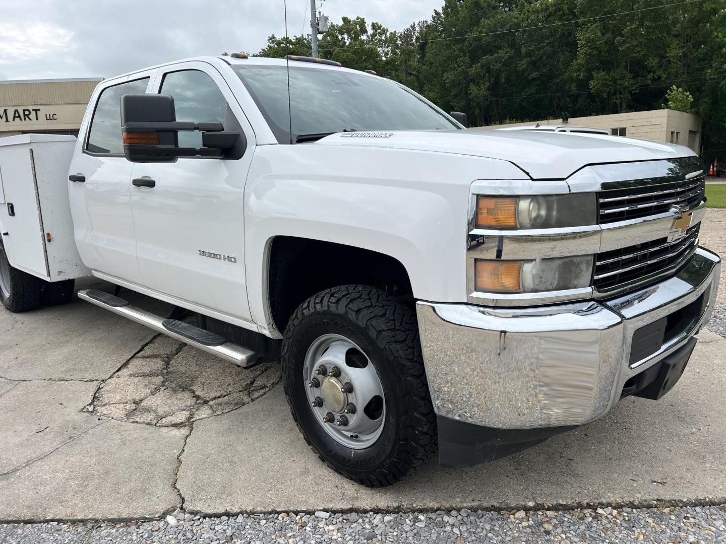 2015 White /Gray Chevrolet Silverado 3500HD Work Truck (1GB4KYC80FF) with an 6.6L V8 OHV 32V TURBO DIESEL engine, Allison transmission, located at 4520 Airline Hwy, Baton Rouge, LA, 70805, (225) 357-1497, 30.509325, -91.145432 - 2015 Chevrolet Silverado 3500HD Crew Cab 4X4 **ONE OWNER & NO ACCIDENTS** 6.6 Duramax Diesel, Allison Transmission, 196K Miles, Cold A/C, Power Windows, Locks & Mirrors, Knapheide Utility Bed, Back Seat Is Missing. FOR INFO PLEASE CONTACT JEFF AT 225-413-0981. CHECK OUT OUR A+ RATING WITH THE BETTER - Photo#3