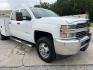 2015 White /Gray Chevrolet Silverado 3500HD Work Truck (1GB4KYC80FF) with an 6.6L V8 OHV 32V TURBO DIESEL engine, Allison transmission, located at 4520 Airline Hwy, Baton Rouge, LA, 70805, (225) 357-1497, 30.509325, -91.145432 - 2015 Chevrolet Silverado 3500HD Crew Cab 4X4 **ONE OWNER & NO ACCIDENTS** 6.6 Duramax Diesel, Allison Transmission, 196K Miles, Cold A/C, Power Windows, Locks & Mirrors, Knapheide Utility Bed, Back Seat Is Missing. FOR INFO PLEASE CONTACT JEFF AT 225-413-0981. CHECK OUT OUR A+ RATING WITH THE BETTER - Photo#3