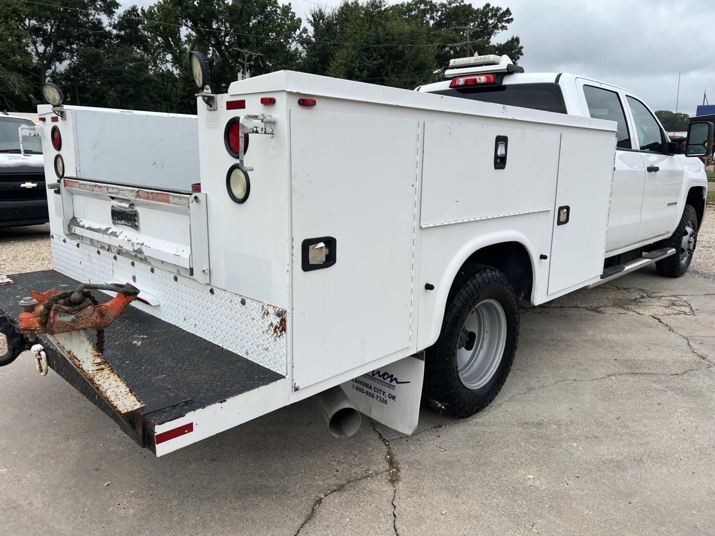 2015 White /Gray Chevrolet Silverado 3500HD Work Truck (1GB4KYC80FF) with an 6.6L V8 OHV 32V TURBO DIESEL engine, Allison transmission, located at 4520 Airline Hwy, Baton Rouge, LA, 70805, (225) 357-1497, 30.509325, -91.145432 - 2015 Chevrolet Silverado 3500HD Crew Cab 4X4 **ONE OWNER & NO ACCIDENTS** 6.6 Duramax Diesel, Allison Transmission, 196K Miles, Cold A/C, Power Windows, Locks & Mirrors, Knapheide Utility Bed, Back Seat Is Missing. FOR INFO PLEASE CONTACT JEFF AT 225-413-0981. CHECK OUT OUR A+ RATING WITH THE BETTER - Photo#5