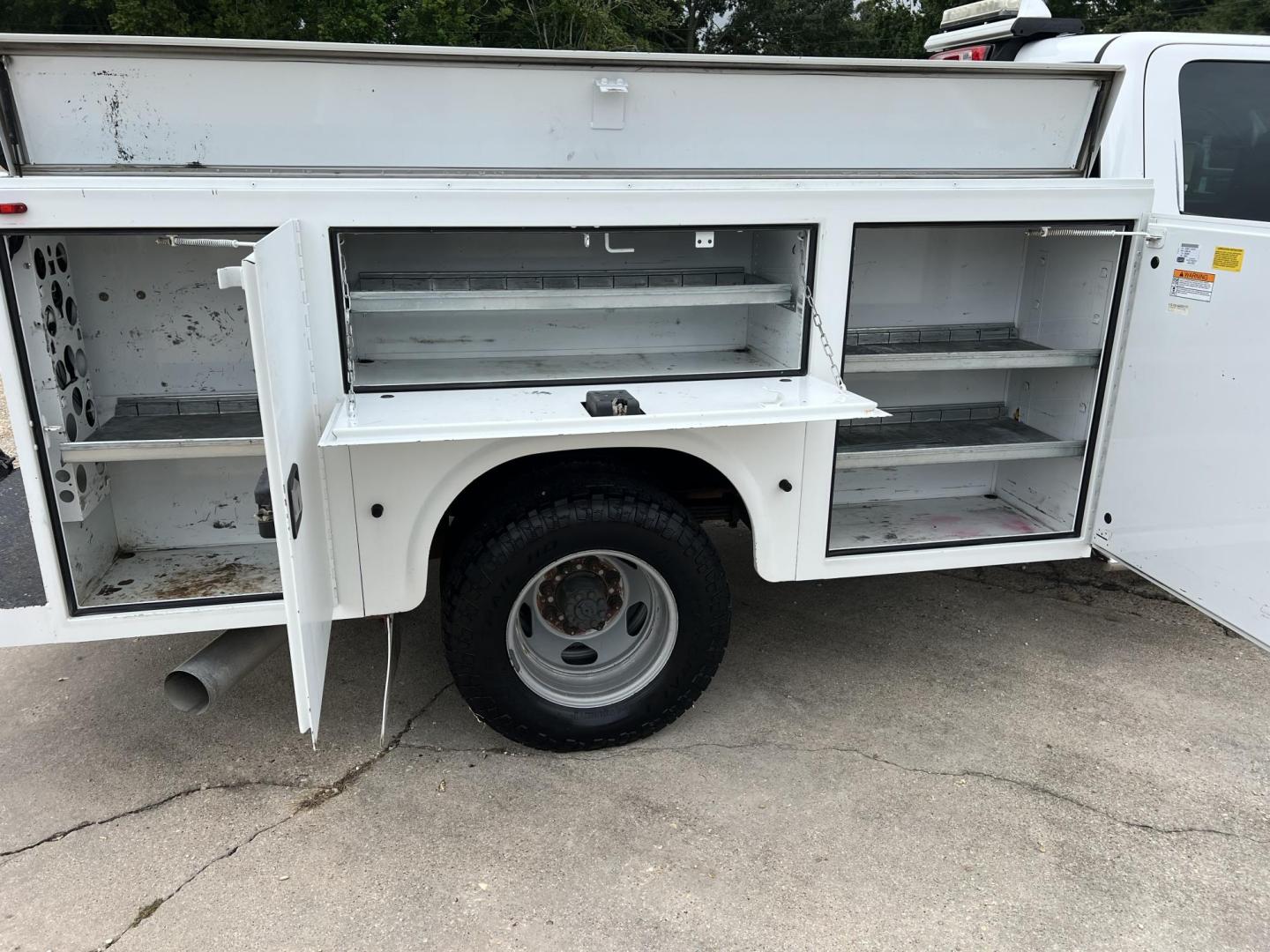 2015 White /Gray Chevrolet Silverado 3500HD Work Truck (1GB4KYC80FF) with an 6.6L V8 OHV 32V TURBO DIESEL engine, Allison transmission, located at 4520 Airline Hwy, Baton Rouge, LA, 70805, (225) 357-1497, 30.509325, -91.145432 - 2015 Chevrolet Silverado 3500HD Crew Cab 4X4 **ONE OWNER & NO ACCIDENTS** 6.6 Duramax Diesel, Allison Transmission, 196K Miles, Cold A/C, Power Windows, Locks & Mirrors, Knapheide Utility Bed, Back Seat Is Missing. FOR INFO PLEASE CONTACT JEFF AT 225-413-0981. CHECK OUT OUR A+ RATING WITH THE BETTER - Photo#10