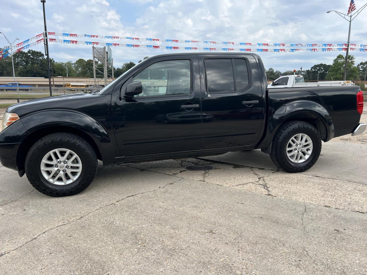 2016 Black /Gray Nissan Frontier SV (1N6AD0ER5GN) with an 4.0L V6 DOHC 24V engine, Automatic transmission, located at 4520 Airline Hwy, Baton Rouge, LA, 70805, (225) 357-1497, 30.509325, -91.145432 - 2016 Nissan Frontier Crew Cab SV 2WD 4.0 V6 Gas, 132K Miles, Automatic Transmission, Power Windows, Locks & Mirrors, Cold A/C, Bluetooth Radio, Tow Package. FOR INFO PLEASE CONTACT JEFF AT 225-413-0981. CHECK OUT OUR A+ RATING WITH THE BETTER BUSINESS BUREAU. WE HAVE BEEN A FAMILY OWNED AND OPERATED- Photo#1