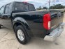 2016 Black /Gray Nissan Frontier SV (1N6AD0ER5GN) with an 4.0L V6 DOHC 24V engine, Automatic transmission, located at 4520 Airline Hwy, Baton Rouge, LA, 70805, (225) 357-1497, 30.509325, -91.145432 - 2016 Nissan Frontier Crew Cab SV 2WD 4.0 V6 Gas, 132K Miles, Automatic Transmission, Power Windows, Locks & Mirrors, Cold A/C, Bluetooth Radio, Tow Package. FOR INFO PLEASE CONTACT JEFF AT 225-413-0981. CHECK OUT OUR A+ RATING WITH THE BETTER BUSINESS BUREAU. WE HAVE BEEN A FAMILY OWNED AND OPERATED- Photo#7